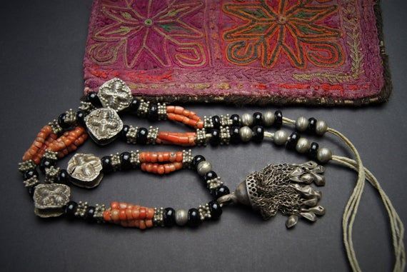 Tajik Wedding NecklaceThis Central Asian necklace was made in the first half of the 20th Century.  The traditional silver beads of the region are of high-grade silver and the coral is natural and not dyed. The black beads are glass. All strung on cotton threads. Collectible and wearable.Necklace drop length of 41 cm or 16 inchesweight 68 gFree deliveryMore ethnic delights on https:www.etsy.com/au/shop/Seraii Asian Necklace, Jade Bead Necklace, Central Asia, The 20th Century, Jade Beads, Ethnic Jewelry, Jewellery Designs, Wedding Necklace, Black Beads