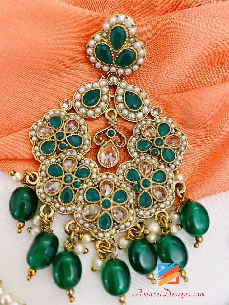 Polki Green Emerald Earrings Tikka Set. Available to shop online and delivered to your doorsteps anywhere in the world with our Everything-Everywhere FREE Shipping. 📦Unmatched FREE Worldwide Shipping EXPLORE more Maang Tikka Sets and Tikka Set Punjabi, INDIAN JEWELRY SETS Match with our pretty Single Line Necklaces Preet, Canada ⭐️⭐️⭐️⭐️⭐️ The payal I ordered was amazing 🤗 I got it in 3-4 days in a beautiful box with thank you note. Such an amazing experience with amazel designs. Thank you Kir Green Dangle Bridal Earrings For Festivals, Green Dangle Hoop Earrings For Celebration, Green Chandelier Earrings For Festivals And Gifts, Traditional Green Pearl Drop Earrings, Green Traditional Chandelier Earrings As Gift, Traditional Green Chandelier Earrings As Gift, Traditional Green Chandelier Earrings For Gift, Festive Green Single Earring Jewelry, Festive Green Earrings For Gift