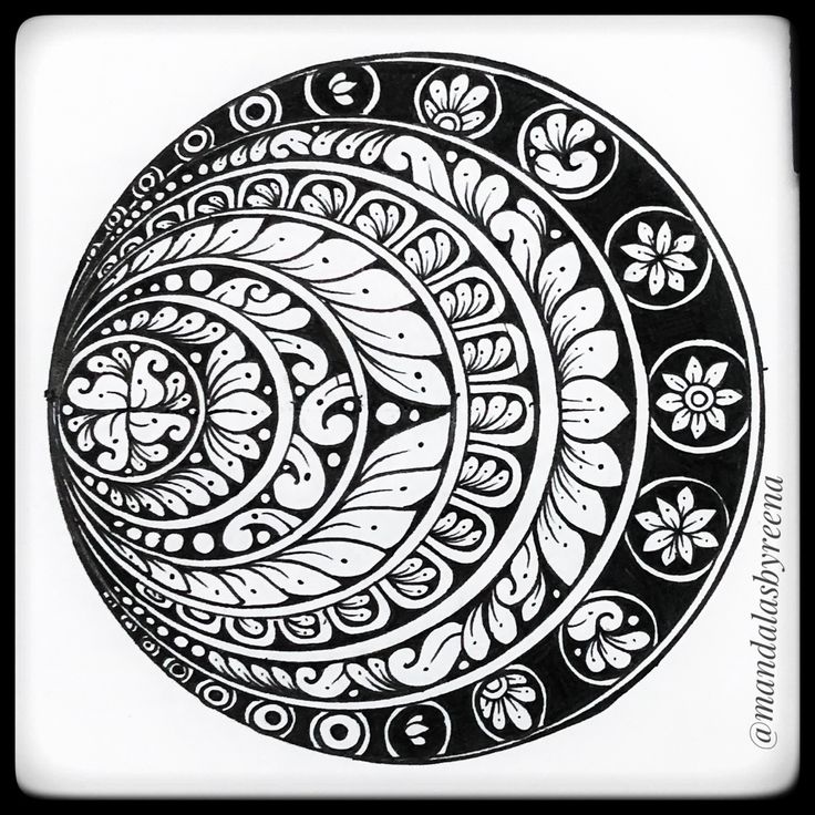 a black and white drawing of four circles with flowers in the center, on a white background