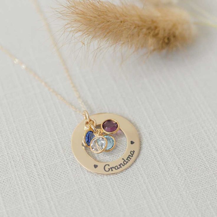 A beautiful golden gift for your Grandma or Mom. What better way to remind her of her family - a necklace personalized with names and birthstones representing each grandchild Product details MATERIAL: 14K Gold Pendant, Plated or Gold Filled ChainSIZE: 1 1/8" (28.575) pendantCHAIN LENGHT: 16", 18", 20" based on selectionCHAIN STYLE: cable, curb, rolo, double ropeBIRTHSTONES: Optional based on selectionENGRAVING: Up to 5 characters (including spaces) around the circumference of the washer Engraved Personalized 14k Gold Jewelry For Keepsake, Customizable Birthstone Necklace For Mother's Day Anniversary, Personalized 14k Gold Keepsake Jewelry, Keepsake Yellow Gold Name Jewelry, Personalized May Birthstone Necklace In Yellow Gold, Anniversary Birthstone Charm Necklace, Personalized Yellow Gold May Birthstone Necklace, Gold Necklace With Names For Mom, Customizable Gold Round Birthstone Necklace