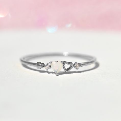 Our love is a forever type of thing! This ring features two petite hearts. It's feminine and simple and the perfect stacking ring. 18k gold plated, 18k rose gold plated, or rhodium plated over brass with a protective coating Cubic zirconia stones Available in sizes 5-8 Approx 3mm width Shop our entire Rings Collection here Promise Rings Cheap, Cute Promise Rings Silver, Simple Silver Promise Rings, Simple Promise Rings For Her Silver, Dainty Promise Rings Silver, Small Rings Simple, Small Promise Rings, Promise Rings Simple Silver, Pretty Promise Rings