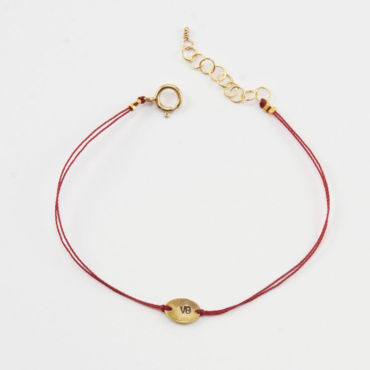 In many cultures, the color red is traditionally used as a symbol of protection, good luck, or blessing. In my native Argentina, red-threaded bracelets are used to ward off evil spirits. The prana bracelets are our modern interpretation of a classic good luck charm. These bracelets are meant to be worn everyday and never take them off until the thread dissolves. They can be worn in the shower. Please, type the letters you want to be stamped on your pendant at check-out!∙ Up to 2 letters permitte Adjustable Gold Brass Jewelry With Cord, Gold Brass Jewelry With Adjustable Cord, Adjustable Cord Brass Gold Jewelry, Gold Jewelry With Adjustable Cord Gift, Minimalist Jewelry Bracelet With Adjustable Cord, Gold Jewelry Bracelet With Adjustable Cord, Minimalist Bracelet With Adjustable Cord, Minimalist Adjustable Cord Bracelet Jewelry, Gold Adjustable Jewelry For Friendship