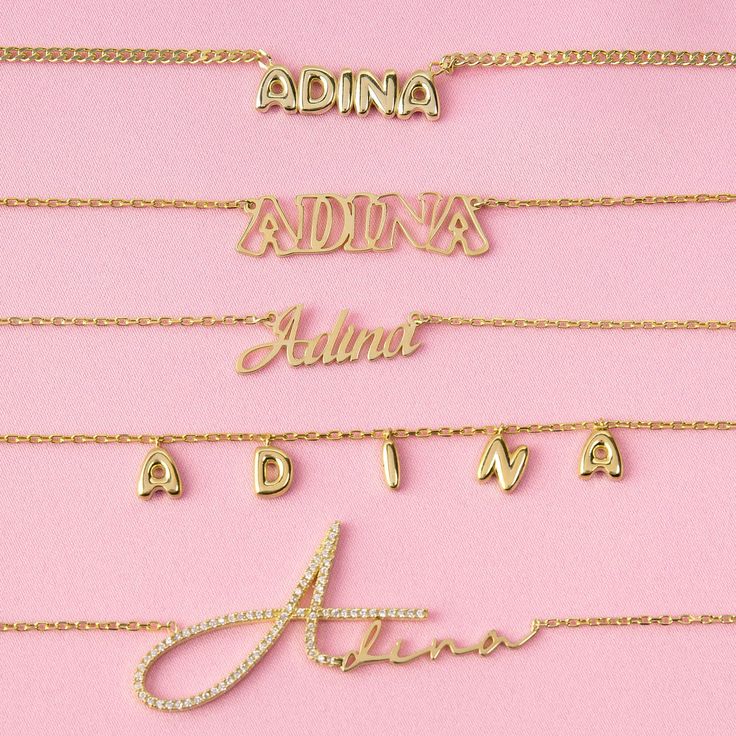 Presenting the Adina Eden Solid Bubble Name Link Necklace, a stunning addition to your jewelry collection that effortlessly combines style and personalization. Crafted from sterling silver and luxuriously gold plated, this necklace exudes elegance and sophistication. The nameplate, standing at a height of 7mm, ensures that your chosen name or word is showcased prominently. The sleek Cuban chain design, with a thickness of 2mm, offers both durability and comfort, while the adjustable length of 15 Cute Chokers, Nameplate Necklace Silver, Customized Necklace, Silver Link Necklace, Sideways Initial Necklace, Name Necklace Silver, Custom Initial Necklace, Necklace Name, Nameplate Necklace