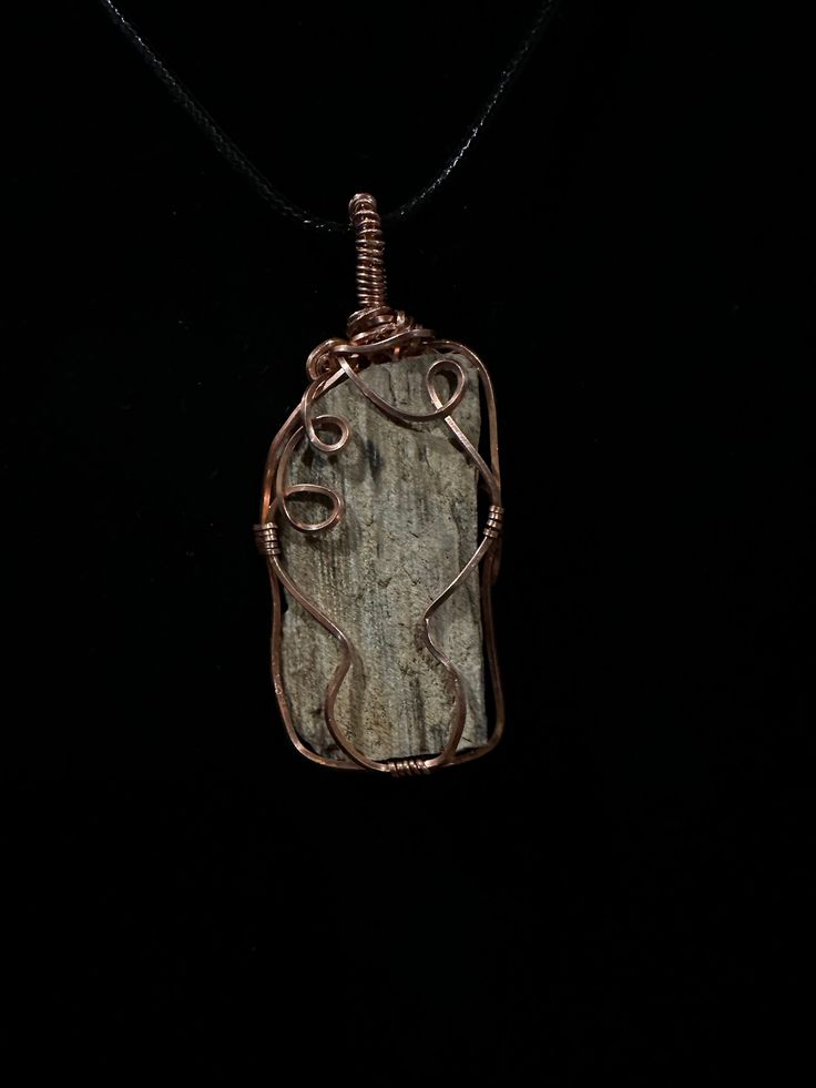 This beautiful natural petrified wood piece was found in west Texas USA . Perfect for anyone who loves nature and history of the planet .  The history this fossil has seen is baffling and the story is your's to tell. Did it grow among our ancient mammalian ancestors , or did it watch dinosaurs brawl amongst the marsh lands? This piece is raw and has not been polished or altered in any way. Take a look at some of our other fossil jewelry. Fossilized wood https://www.etsy.com/listing/1256039229/na Rustic Agate Jewelry For Healing, Handmade Rustic Agate Jewelry, Handmade Natural Wood Pendant Jewelry, Unique Natural Wood Pendant Jewelry, Earthy Hand-wrapped Natural Jewelry, Handmade Nature-inspired Natural Jewelry, Earthy Hand Wrapped Natural Jewelry, Nature-inspired Natural Stones Jewelry, Bohemian Natural Wood Necklaces As Gift