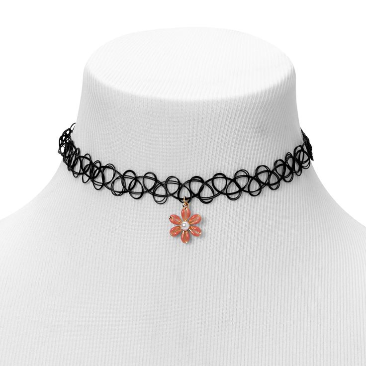 The dangling daisy charm gives off the '90s vibe you crave. It hangs from a gold-tone chain that is attached to a tattoo choker necklace, making this a totally rad choice for an everyday look. Finish: Gold-tone Length: 8'' Closure: Stretch Material: Metal - Claire's Pink Daisy Charm Black Tattoo Choker Necklace Adjustable Black Jewelry With Flower Charm, Trendy Adjustable Necklace With Flower Charm, Trendy Metal Jewelry With Flower Charm, Trendy Adjustable Jewelry With Flower Charm, Adjustable Trendy Jewelry With Flower Charm, Accesorios Aesthetic, Oc Things, Choker Simple, 90s Choker