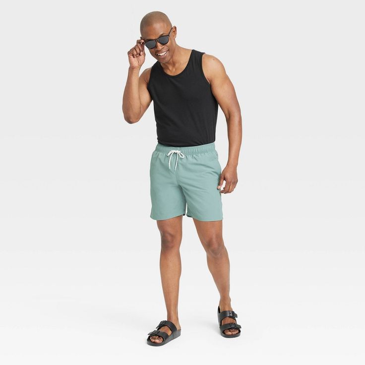 Bring cool comfort to warm-weather days with this Standard-Fit Tank Top from Goodfellow & Co™. Crafted from a lightweight jersey fabric, this standard-fit tank top offers you all-day cool comfort. Falling at the hip for wearing tucked in or untucked, you can coordinate this solid round-neck tee with different bottoms, or layer it under a button-down or hoodie for versatile styling. Goodfellow & Co™: Where style & fit are always in good company. Black Casual Swimwear For Vacation, Casual Black Swimwear For Vacation, Summer Beachwear Swimwear For Leisure, Casual Solid Swim Trunks For Beach Season, Sporty Relaxed Fit Swim Trunks For Vacation, Leisure Cotton Swim Trunks For Summer, Sporty Relaxed Fit Swimwear For Beach Season, Black Swim Trunks For Spring Beachwear, Summer Cotton Leisure Swim Trunks