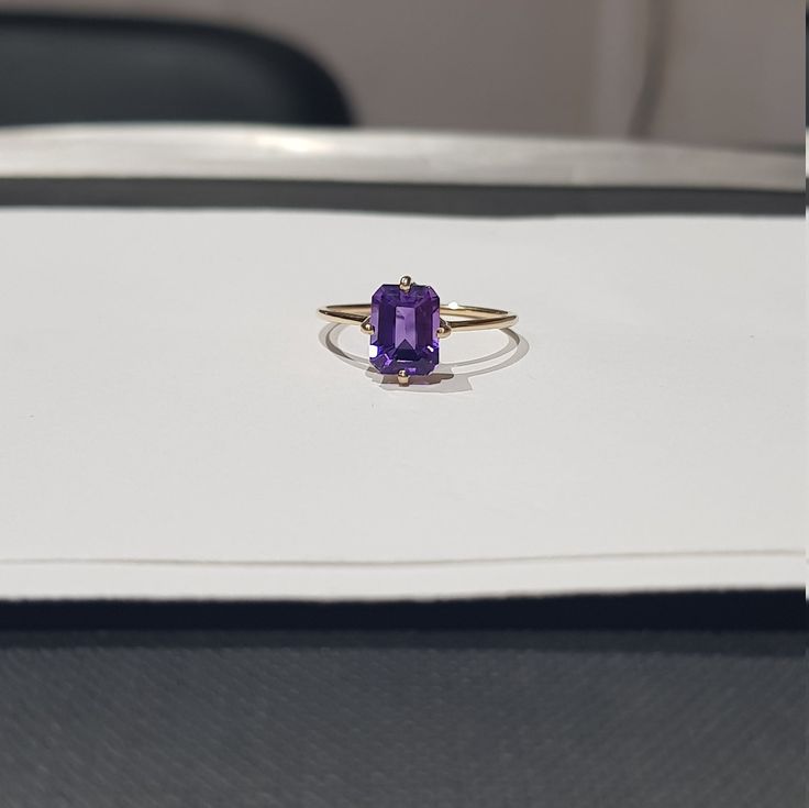 14k solid yellow gold natural emerald cut shaped amethyst gemstones ring. 1. The weight of the natural amethyst gemstone used in the ring =1.50 cts. 2. The weight of the 14k solid yellow gold used in the ring =1.170 grms. 3. The amethyst is the birthstone for the people born in the month of February. 4. The design of the ring is very nice and beautiful. 5. I have used all my skills and experience to manufacture this ring as beautiful as I can and I do hope that my work will be appreciated. Thank Yellow Gold Amethyst Ring With Emerald Cut, 14k Gold Emerald-cut Amethyst Ring, Rectangular Amethyst Ring In 14k Gold, 14k Yellow Gold Emerald-cut Amethyst Ring, Rectangular Amethyst Ring In Yellow Gold, 14k Yellow Gold Emerald Cut Amethyst Ring, Rectangular Amethyst Rings In Yellow Gold, Yellow Gold Amethyst Ring With Rectangular Shape, 14k Yellow Gold Amethyst Ring, Emerald Cut