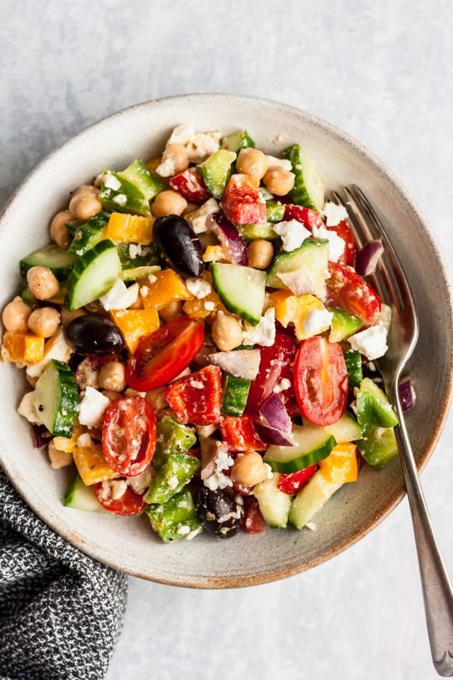 an image of a salad with chickpea and tomatoes in it on a plate