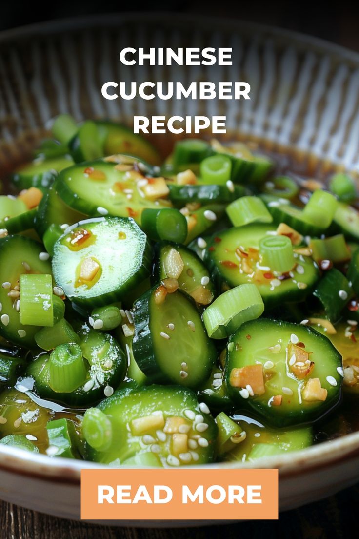 a bowl filled with cucumber and sesame seeds on top of a wooden table