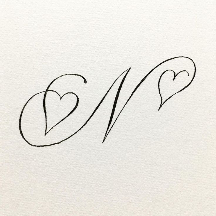 the word love written in cursive writing on white paper