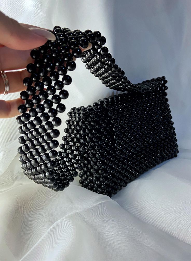 Elegant Black Beaded Bags, Luxury Black Beaded Evening Bag, Trendy Black Bags With Pearl Handle, Black Handheld Bag With Pearl Handle, Black Handheld Bags With Pearl Handle, Black Beaded Square Shoulder Bag, Rectangular Bag With Black Beads As Fashion Accessory, Black Rectangular Bag With Pearl Handle, Black Beaded Handheld Shoulder Bag