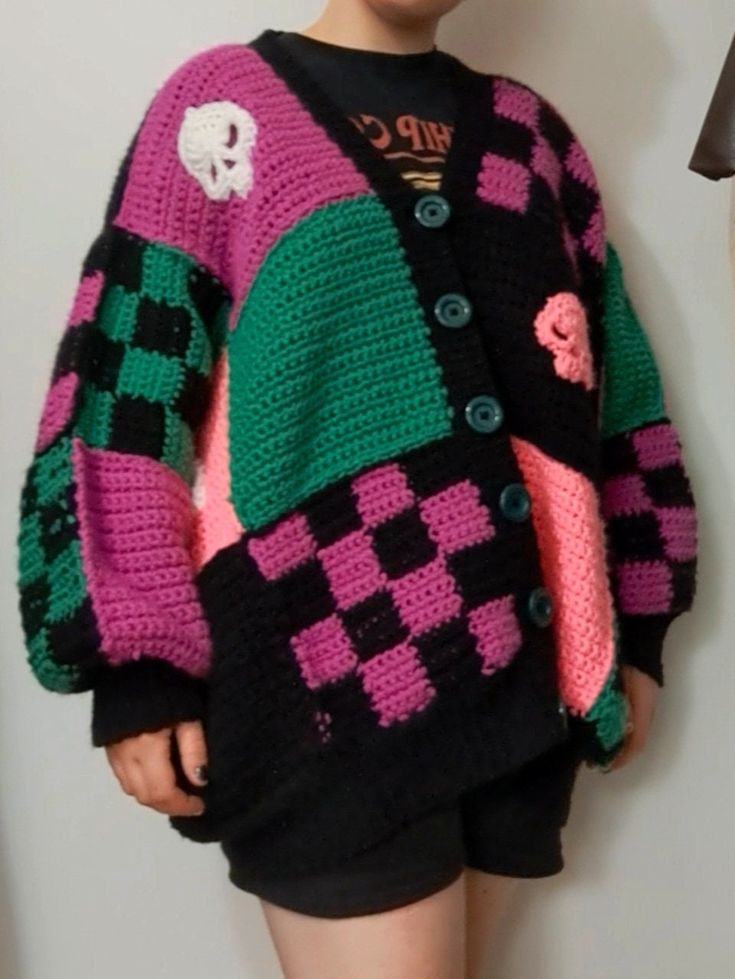 handmade oversized crochet patchwork cardigan inspired by Monster high - one of a kind unique design 100% acrylic yarn (oversized on small/medium, fits larger). Hand or cold wash only. Spooky Crochet Cardigan, Crochet Cardigan Inspiration, Monster High Crochet Clothes, Crochet Halloween Clothes, Halloween Crochet Clothes, Crochet Skull Sweater, Green And Purple Crochet, Checker Crochet, Oversized Crochet Sweater