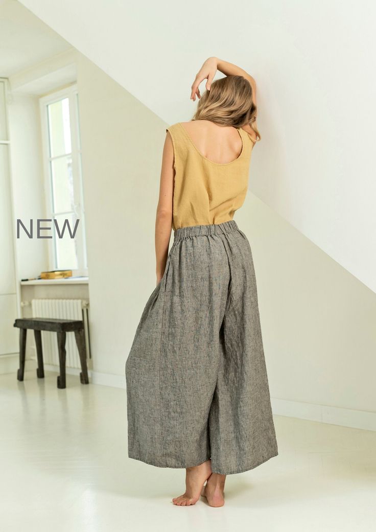 "Linen culotte pants with extra wide bottom. These culottes combine elegance of the skirt and comfort of the pants. Darts around the waist create an optically thinner waistline. These flowy culottes are perfect for work as well as leisure. You will always stand out and feel super stylish wearing them. Double washed for extra softness and shrinkage prevention. ABOUT US LINEN ID was born from desire to embrace things that actually matter. We aim to create sustainable garments that offer uncompromi Baggy High Waist Linen Wide Leg Pants, Linen Wide Leg Harem Pants With Elastic Waistband, Wide Leg Linen Harem Pants With Elastic Waistband, Spring Linen Wide Leg Culottes, Spring Wide Leg Linen Culottes, High Waist Linen Wide Leg Pants For Summer, Baggy Wide-leg Summer Culottes, Summer Wide Leg Flax Colored Pants, Linen Wide-leg Culottes