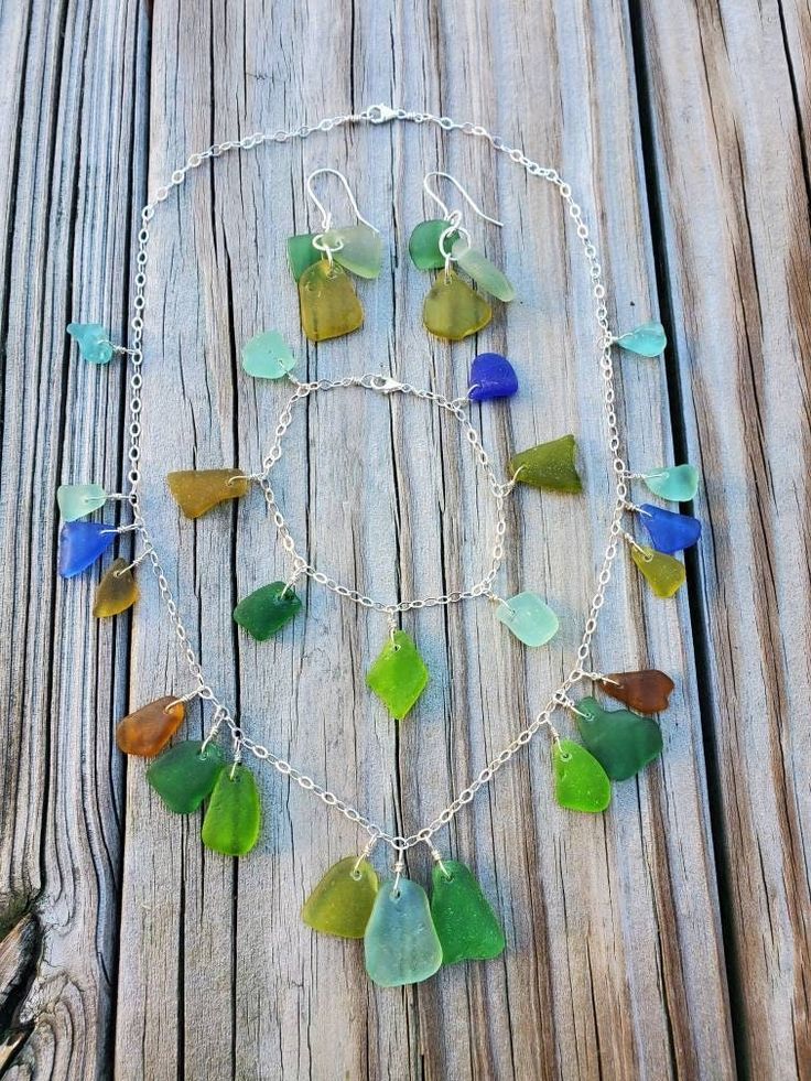 "This set of genuine sea glass jewelry features 30 pieces of colorful sea glass found on the beach handmade into a sea glass necklace, a sea glass bracelet and a pair of sea glass earrings with solid sterling silver. Only 1 set of sea glass jewelry available, so you will receive the exact set as in the pictures and video! The metal in this set of sea glass jewelry is all solid sterling silver. The sea glass necklace is 20\" long in total but you can hook the lobster clasp into any chain link if Best Bridal Shower Gift, Sea Glass Bracelet, Sea Glass Earrings, Sea Glass Necklace, Glass Bracelet, Unique Necklace, Sea Glass Jewelry, Garden Gifts, Glass Earrings