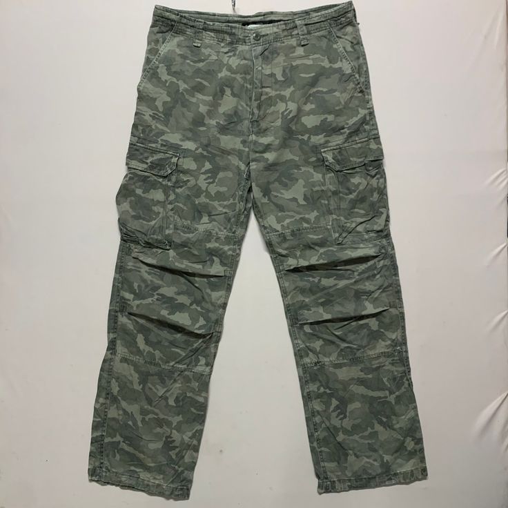 [DESCRIPTION] Please read the description first before buy my items‼️‼️‼️ Vintage Camp David Multipocket Tactical Camo Cargo Pants All in good condition [MATERIAL] Cutton [MEASUREMENT] Measurement ( WHEN LAID FLAT ): Waist: 36 inch (recommended) Insean: 30.5 inch Length: 41.5 inch Front Rise: 12 inch Thigh: 23 inch Opening Leg: 19 inch [CONDITION] - All in good condition  - No hole no stain [PAYMENT & NOTICE] - We accept PayPal ONLY - No return/refund - All items will be post over shipping compa Military Style Cotton Cargo Pants For Outdoor, Combat Cargo Pants With Pockets, Military Style Cotton Cargo Pants For Outdoor Activities, Tactical Cargo Jeans For Outdoor Activities, Combat Cargo Pants With Side Pockets, Combat Style Khaki Cargo Pants For Hiking, Combat Cargo Pants For Hiking, Khaki Military Cargo Pants For Outdoor, Camouflage Straight Leg Utility Cargo Pants