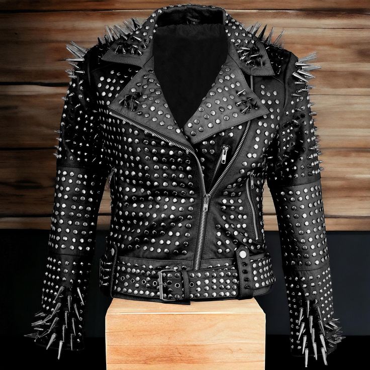 Women's Studded Jacket, Black Punk Long Silver Studded Spiked Brando Style Motorcycle Leather jacket - Nietenbesetzte Lederjacke About this item *MATERIAL: Women's Full Long Spiked Genuine Leather jacket Handcrafted Fully Studded Jacket from the finest quality Real leather and has a soft viscose inner lining that ensures durability and comfort. *STYLE: High quality Premium Leather, Soft and Comfortable Inner Lining, Full Long Spiked on Shoulder and Cuffs Sleeve. YKK Zip on Front and Sleeve. *Siz Edgy Leather Jacket With Spikes, Edgy Long Sleeve Leather Jacket With Spikes, Punk Style Outerwear With Rivets For Fall, Edgy Studded Biker Jacket For Winter, Rock Style Studded Leather Jacket With Long Sleeves, Punk Style Studded Outerwear For Fall, Fall Leather Jacket With Spikes And Long Sleeves, Punk Long Sleeve Outerwear With Rivets, Winter Rock Style Leather Jacket With Studs