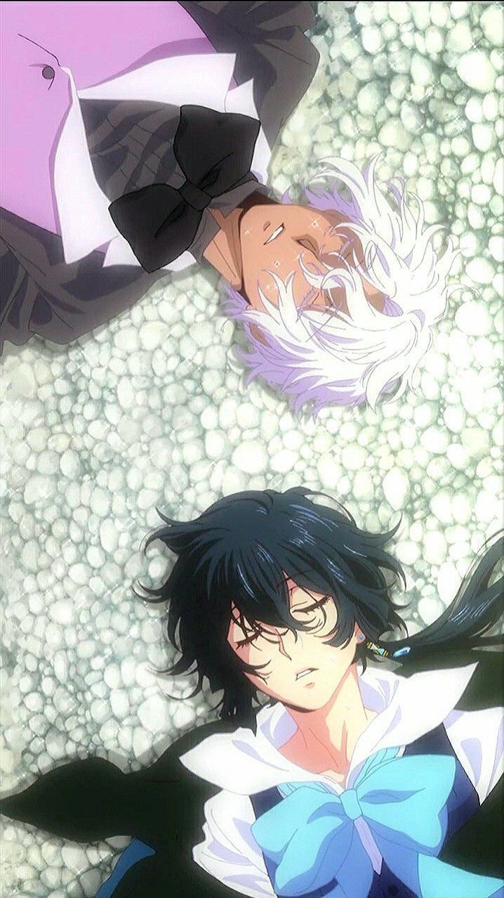 two anime characters laying down on the ground