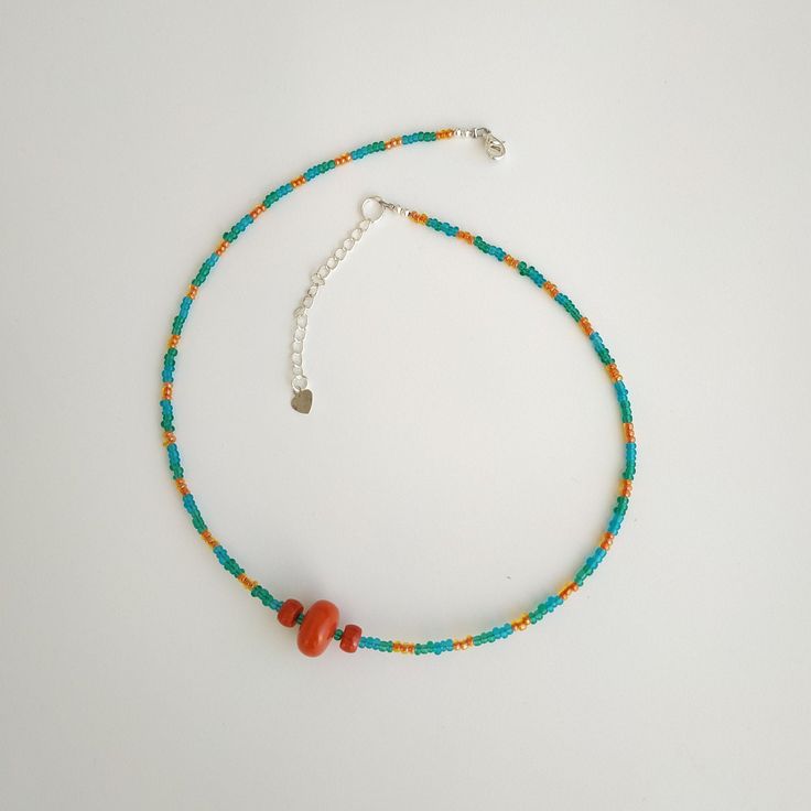 < Glass and Coral beaded Necklace > Like 99% of the coral on the market these days, this coral has been dyed. I use bamboo coral which is not endangered or threatened in any way, unlike natural pink or red coral (the production of which is forbidden almost everywhere in the world). Bamboo coral doesn't mean it's not organic. Every bead of it has a distinctive and beautiful coral pattern. My jewelry dyed with high quality paint. It's safe for your health and the paint does not fade. Necklac Adjustable Coral Beaded Necklace With Large Beads, Adjustable Large Bead Coral Necklace, Handmade Coral Beads For Beach, Bohemian Red Coral Beads With Colorful Details, Adjustable Single Strand Beaded Necklace In Red Coral, Bohemian Coral Gemstone Beads, Bohemian Orange Single Strand Beads, Handmade Artisan Coral Beaded Necklaces, Artisan Coral Beaded Necklace Handmade