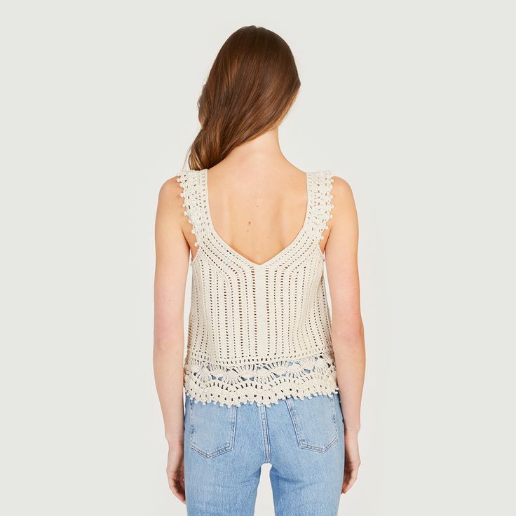 The crochet detailed top is cut from lightweight cotton in the best summer hue. The details are cut with feminine patterns, a breathable summer staple. 100% ITALIAN. The Italian yarn originates from Northern Italy. Fabric 100% Cotton Imported Yarn from Italy Fine Knit Dry Clean Fitting & Design Model is 5'9" and is wearing a size Small V-Neck Sleeveless Pointelle Details Fits true to size, take your normal size Color: Hemp SKU: #N12375 Delivery Free Shipping for all U.S. residents Internatio Spring Crochet V-neck Top, Summer V-neck Tops With Crochet Lace, Bohemian Pointelle Knit V-neck Top, Bohemian V-neck Pointelle Knit Top, Spring Cotton Knit Top With Crochet Lace, Chic Summer Crochet Top With Crochet Trim, Bohemian Cotton Crochet V-neck Top, Spring Cotton Lace Top With V-neck, V-neck Tops With Crochet Trim For Vacation