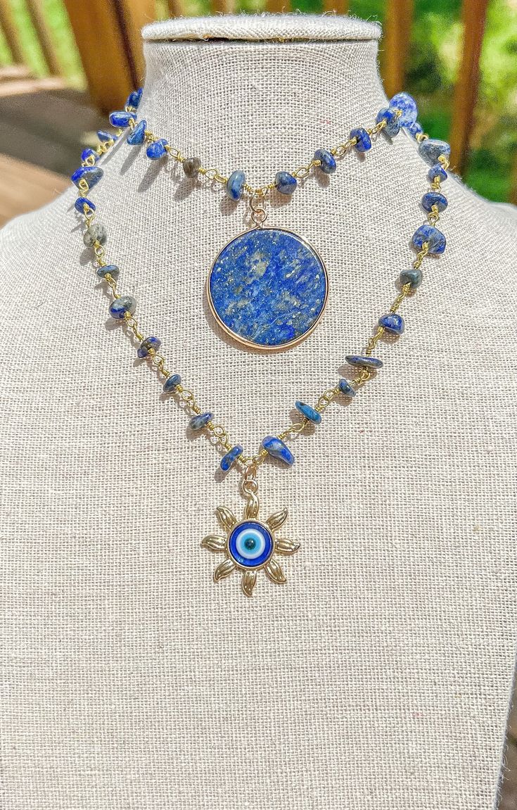 "Lapis Lazuli Gold Wire Wrapped Crystal Necklace/Crystal Jewelry/Gemstone Choker Style Necklace/Hippie Necklace/Hippy Jewelry/Handmade Rosary - Choker style crystal necklace with Lapis Lazuli Crystal faceted Beads and 2 charms to choose from a sun charm and Lapis Lazuli Stone round flat charm - Length is 15\",\"16\", 17\", 18\" or 19\" - Materials: Gold plated copper wire, natural Lapis Lazuli crystals and, brass or stone charm Check other styles in my shop: https://www.etsy.com/listing/14425635 Lapis Lazuli Gemstone Crystal Necklaces For Jewelry Making, Lapis Lazuli Gemstone Necklace For Jewelry Making, Bohemian Gold Crystal Necklaces, Handmade Crystal Spiritual Necklaces, Handmade Lapis Lazuli Jewelry For Festivals, Bohemian Crystal Pendant Necklaces, Bohemian Crystal Necklace For Gift, Bohemian Crystal Necklace For A Gift, Handmade Crystal Pendant Necklaces