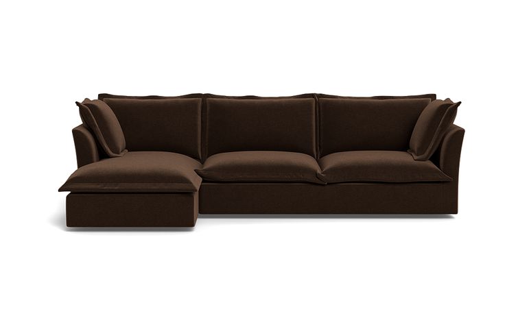 a brown couch with pillows on it