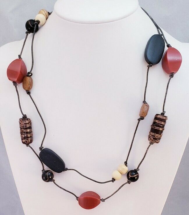 This is a Chico's Brand Red Moon Boho Mixed Beaded Venetian Glass Bib Necklace. The metal extender is a silver tone metal. The necklace measures 25" at the longest, it is adjustable and weighs 1.5 oz. It is NWT N17 Items are shipped from a smoke-free home. Photos are part of the listing so PLEASE look at all pictures. And if an item is Sterling Silver it may tarnish in time, I suggest you buy a Polishing Cloth (one brand is called SUNSHINE CLOTH) and take care of it, Wearing it in water will als Brown Long Necklace With Colorful Beads For Gift, Gift Brown Long Necklace With Colorful Beads, Gift Long Brown Necklace With Colorful Beads, Casual Red Necklace For Festival, Casual Red Festival Necklaces, Brown Necklaces With Black Beads For Beach, Casual Red Beaded Chain Jewelry, Casual Red Beaded Necklace, Red Casual Beaded Necklaces For Festivals