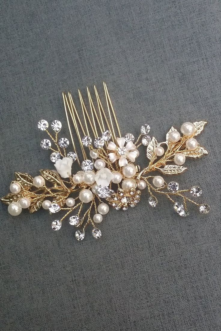 "This lovely wedding gold hair comb is hand wired with crystal, pearl and leaf metal. The floral hair comb(s) are perfect for your wedding hair or special occasion.  Details: Total Measurement Approx. 4\" x 2\"  Color: White crystals, white pearls, gold leaves, gold crystal flower, brushed metal flower, white acrylic flowers Picture pages: Gold: page 1,2,3 &4 Silver: page 5 & 6 Antique gold: page 7 & 8 Rose gold: 9 & 10" Gold Hair Clips Wedding, Gold Bridesmaid Hair Accessories, Gold Hair Piece Wedding, Floral Hair Comb Wedding, Gold Wedding Hair Piece, Gold Wedding Flowers, Gold Hair Piece, Bridesmaid Hair Pieces, Wedding Hair Clip