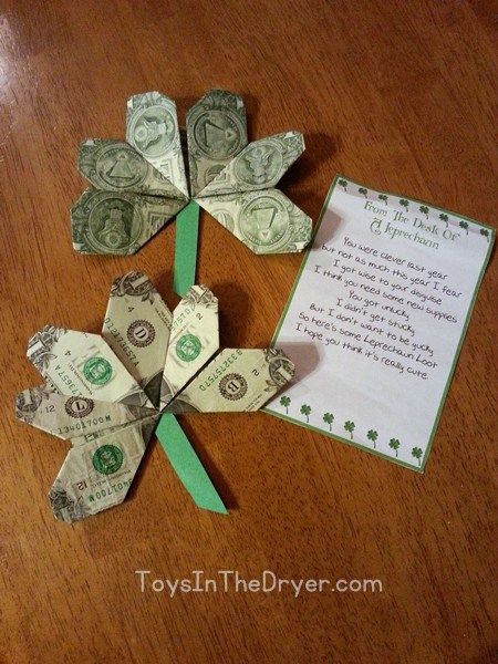 four dollar bills are folded into the shape of a flower with a note attached to it