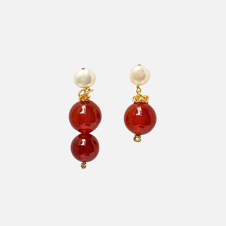 The Anita Berisha At Dusk Earrings are hand-crafted entirely with 12K gold fill, freshwater pearls, and carnelian gemstones, with an asymmetrical twist Dimensions: approx 1.8" + 1.2" Please note each earring set is unique due to the natural shape/color of the gemstones and pearls. Pearl Gemstone, Asymmetrical Design, Natural Shapes, Handmade Design, Statement Earrings, Fresh Water, Earring Set, Freshwater Pearls, Free Gifts