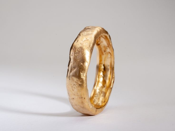 Details:  RMY698  Weight: about 4g  Thickness: 2.1-2.2 mm (hollowed)  Width: about 6 mm  14k solid yellow gold This chunky gold wedding band has a unique hammered and textured surface. This ring has an organic gold finish which looks like melted gold. A truly unique gold band with lots of personality and style! Great for both men and women.  ◈ ALSO AVAILABLE IN  14K in yellow, rose and white gold 18K Rose and White Gold  22K Solid Yellow gold  ◈ ENGRAVING is optional for $7 per letter/number/character. Please pay using the engraving order form at this link: https://www.etsy.com/il-en/listing/1067854382/personalisation-engravings?ref=shop_home_active_1&frs=1&crt=1 Please note that engraved jewellery cannot be exchanged or returned ◈ SHIPPING is insured express and free worldwide ◈ GIFT WRAP Wedding Band Thick, Chunky Wedding Band, Organic Gold Ring, Melted Gold, Textured Ring Band, Ring Texture, Thick Wedding Bands, Hammered Wedding Band, Textured Gold Ring