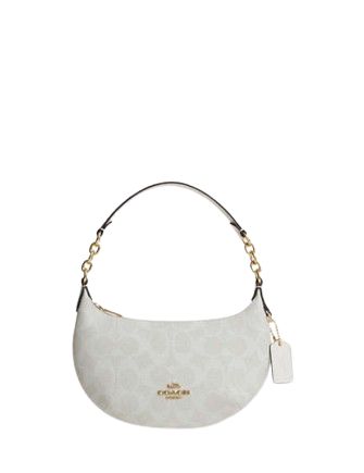 a white coach purse on a white background