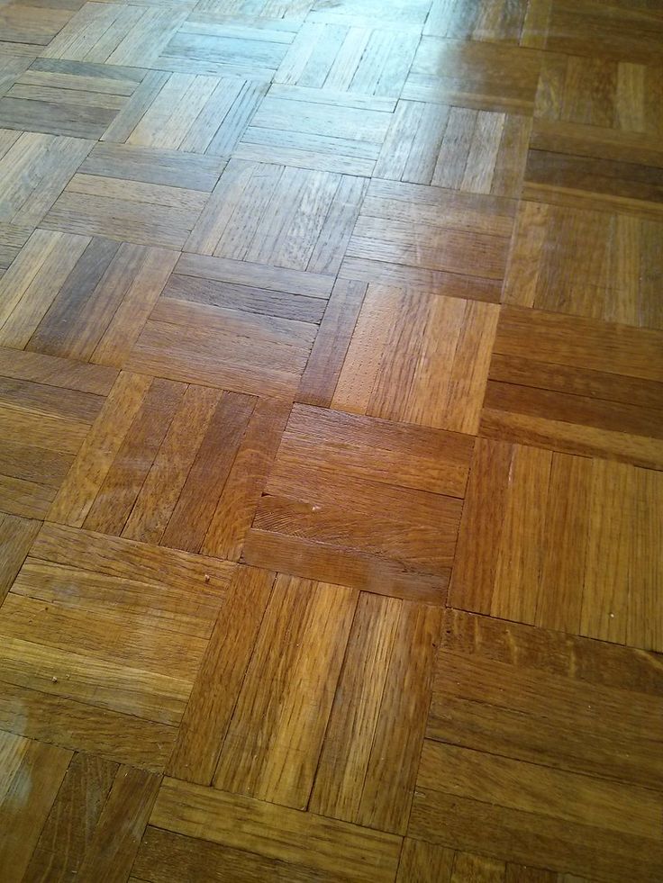 the floor is made up of wood planks and has an interesting pattern on it