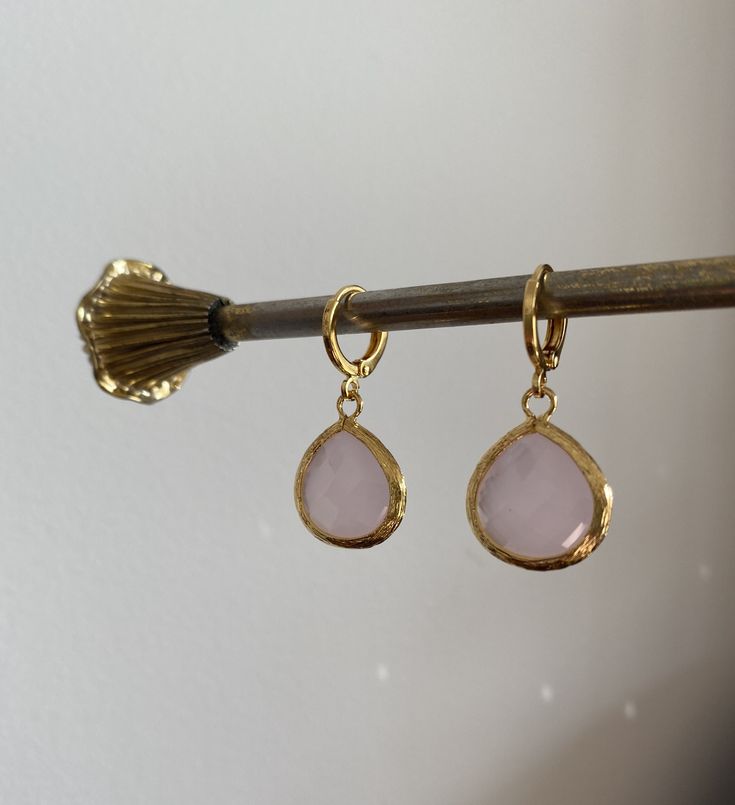 Rose water opal jewel earrings with a gold-plated or rhodium-plated frame. The jewel measures 1.5 cm x 1.9 cm and hangs on gold-plated or rhodium-plated huggie hoop earrings measuring 1.2 cm x 1.4 cm. As seen on Millie Mackintosh from the TV show Made In Chelsea. Comes in a black velvet pouch. If these are a gift and you would like a box free of charge please mark the order as gift or leave a message at check out. Teardrop Clip-on Hoop Earrings Gift, Clip-on Teardrop Hoop Earrings Gift, Teardrop Gold Plated Huggie Earrings For Gift, Gold Plated Teardrop Huggie Earrings For Gift, Gold-plated Teardrop Clip-on Jewelry, Gold Plated Teardrop Clip-on Jewelry, Rose Gold Teardrop Hoop Earrings Gold Plated, Rose Gold Teardrop Earrings, Rose Gold Teardrop Hoop Earrings For Gift