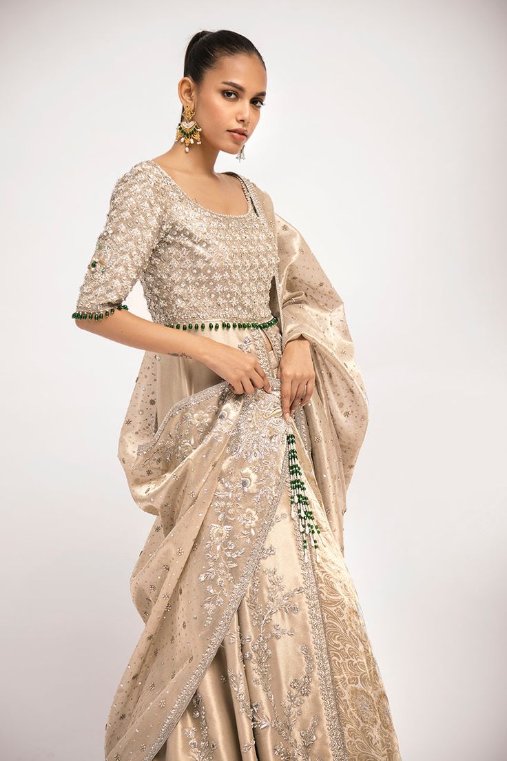 Sumira – Sania Maskatiya International Party Choli With Intricate Embroidery In Raw Silk, Raw Silk Anarkali Set With Zari Work For Reception, Transitional Reception Salwar Kameez With Zari Work, Hand Embellished Lehenga For Wedding And Transitional Seasons, Transitional Season Dola Silk Salwar Kameez For Reception, Reception Dabka Work Raw Silk Anarkali Set, Reception Sharara With Zari Work, Raw Silk Anarkali Set With Dabka Work For Reception, Anarkali Hand Embellished Salwar Kameez For Festive Occasions