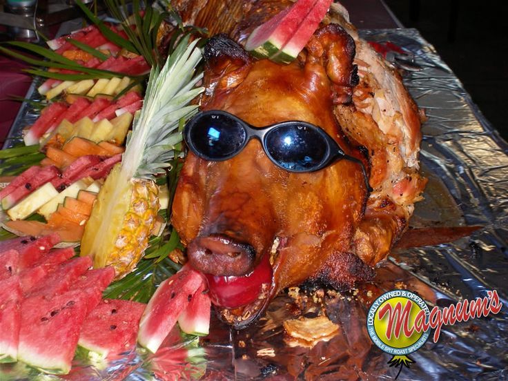 a turkey with sunglasses on it's face surrounded by watermelon and pineapples