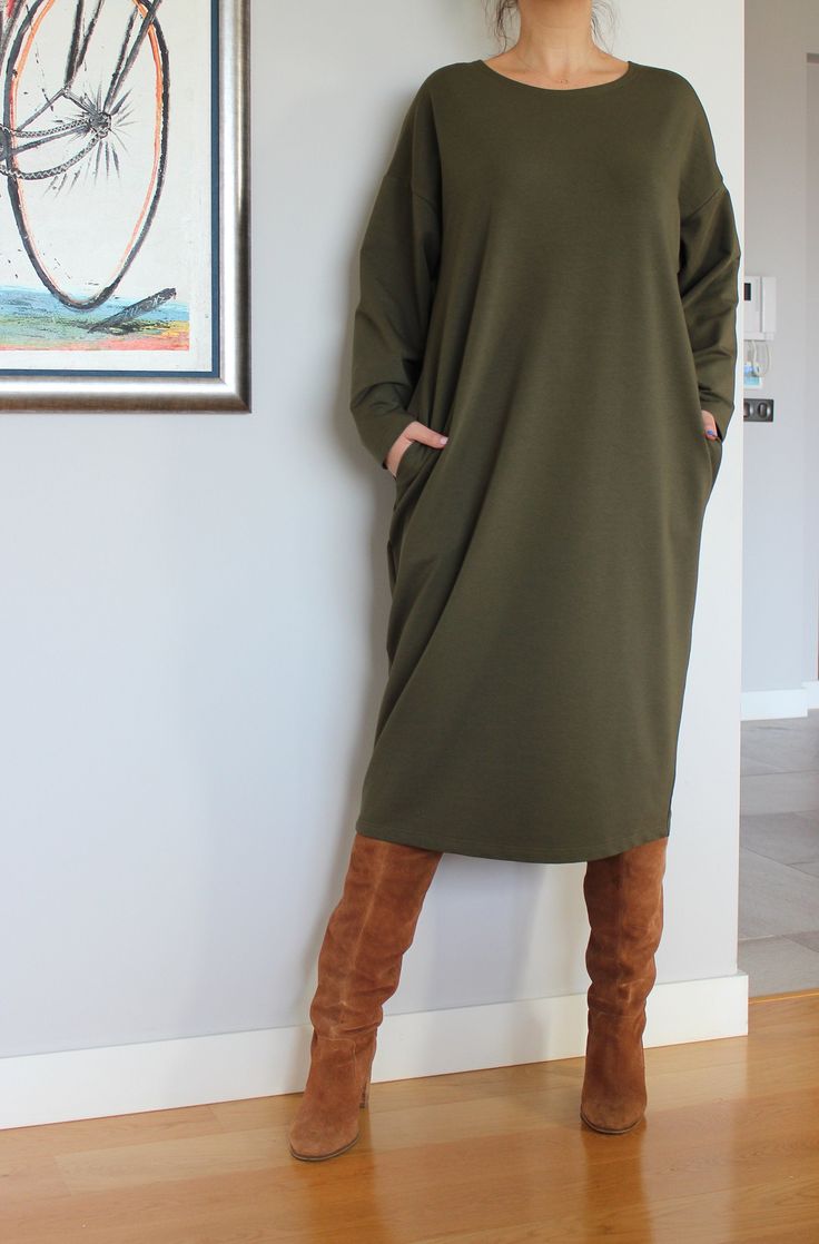 "Olive Green Sweater Dress, Plus Size Clothing, Loungewear Dress, Jumper Dress, Long Sleeve Dress, Pocket Dress, Plus Size Dress,Caftan Dress Lovely, comfy, stylish Jumper Dress - perfect for daywear or loungewear. Super easy to wear and easy to care. At Cherry Blossoms we aspire to make clothing that brings chic style to any size figure with comfortable fabrics, meticulous tailoring and original, beautiful designs! 🍒 A very good choice for the Fall/Winter/Spring Seasons :) Accessorize your dre Khaki V-neck Dress With Pockets, Oversized Tunic Dress For Work, Oversized Green Dress For Fall, Green Long-sleeved Dress With Pockets, Oversized Green Midi Dress, Oversized Green Tunic Dress, Relaxed Fit Long Sleeve Dress With Side Pockets, Green Relaxed Fit Long Sleeve Dress, Oversized Long Sleeve Dresses With Side Pockets