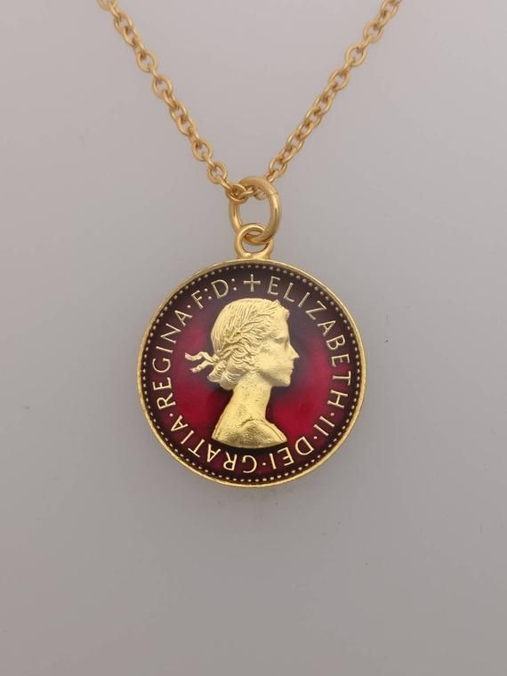 1956 Wren Farthing NecklaceA genuine coin has been used, 1956 was the last year that the Farthings were minted which means they are scarcer.The coin has been polished and gold plated.It has then been hand enamelled on both sides in red. Diameter: 20.2mmChain is 18" and gold plated The pendant comes in a presentation box with a certificate of authentication. Classic Coin Jewelry For Commemoration, Vintage Yellow Gold Jewelry With Coin Pendant, Vintage Coin Pendant Jewelry, Vintage Charm Pendant Coin Necklace, Vintage Pendant Coin Necklace With Charm, Vintage Yellow Gold Round Coin Necklace, Vintage Gold Coin Necklace, Antique Coin Necklace For Anniversary, Vintage Coin Necklaces