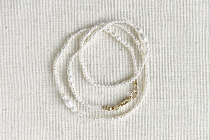 It isn't perfection, but our unique individualism, that gives us all beauty. Meet Esme, a delicate strand of multi-shapes and varying sizes of pearls strung together with artful beauty in mind. Dainty and sweet, perfect for any occasion. DETAILS Pearl diameter 1.5mm-5.5mm * Genuine freshwater pearls * 14k gold-filled | Sterling silver * Silk string * Handcrafted with love & care * Special order item * Complimentary gift wrapping service (See FAQ for details) SPECIAL ORDER ITEM Please note that e Pearl Farm, Silver Silk, Gift Wrapping Services, Freshwater Cultured Pearls, New Yorker, Instagram Fashion, Freshwater Pearls, Necklace Etsy, Gold Filled