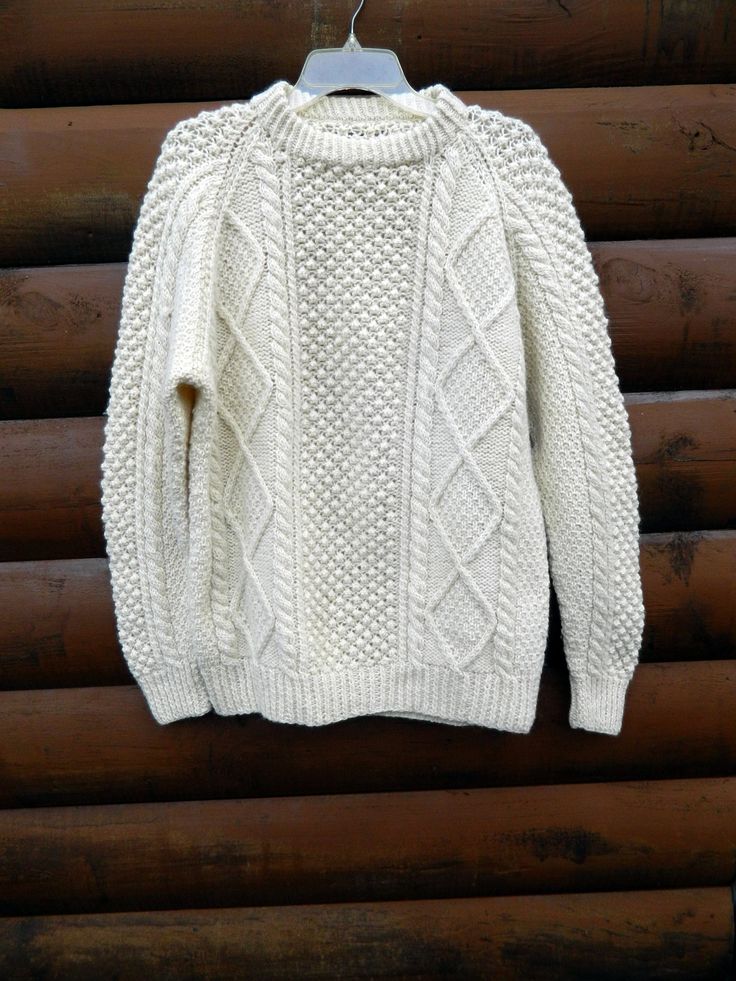 Vintage Hand Aran Fisherman Knit Unisex Sweater Pull Over  Unisex Large - XL this is handmade so there is no size listed - please see measurements 100% Wool Excellent Condition with no holes, stains or odors Measurements Measurements with garment lying flat Chest 26" Length:   32" Sleeve Length: 32" Shipping and Handling: Order ships out within 1-2 business days, excluding Sundays and Holidays in United States. For Domestic Shipping, I use Standard Post with USPS Tracking to confirm delivery of package, delivery is in 2 to 8 days after shipping. For International Shipping, I use First-Class Package International Service with Registered Mail, delivery time varies by destination country. Please contact me before purchase for International Shipping information. Inv. No. Z Winter Hand Knitted White Top, Winter White Hand Knitted Top, Hand Knitted White Winter Top, White Knit Sweater Relaxed Fit, White Knit Sweater With Relaxed Fit, White Relaxed Fit Knit Sweater, White Knitted Merino Wool Sweater, White Knitted Wool Tops, White Wool Knitted Tops