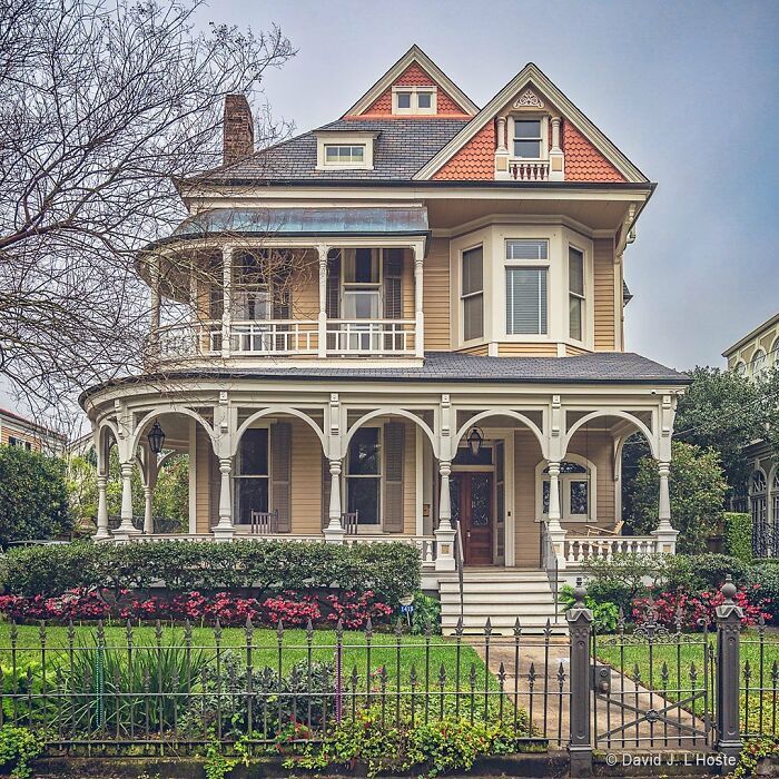 an old victorian house with many windows and balconies