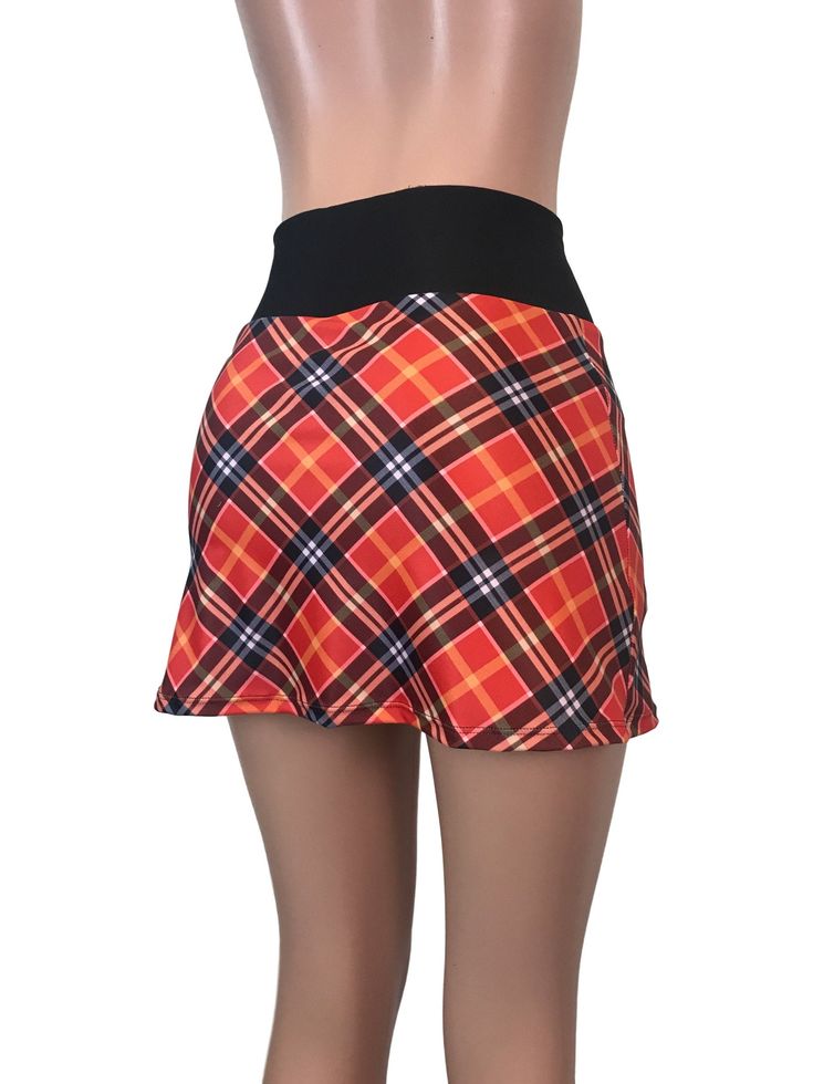 Step up your game in this fun and colorful athletic skirt with built in compression shorts and pocket. This golf, tennis, running or sports skirt is slim-style, but allows for plenty of movement, made of a red plaid high quality performance spandex. The compression shorts are uniquely designed to be incredibly comfortable and won't ride up during activity. The pocket is positioned on the side of the shorts, and will fit your phone, keys, ID, etc. *Please see size chart in images above for standa Fitted Mini Skort For Tennis, Fitted Tennis Skort With Elastic Waistband, Fitted Sporty Swim Skirt, Fitted Tennis Swim Skirt With Elastic Waistband, Casual Stretch Mini Skirt For Tennis, Fitted Mini Tennis Shorts, Casual Fitted Tennis Skort, Casual Fitted Tennis Mini Skirt, Fitted Mini Length Tennis Shorts