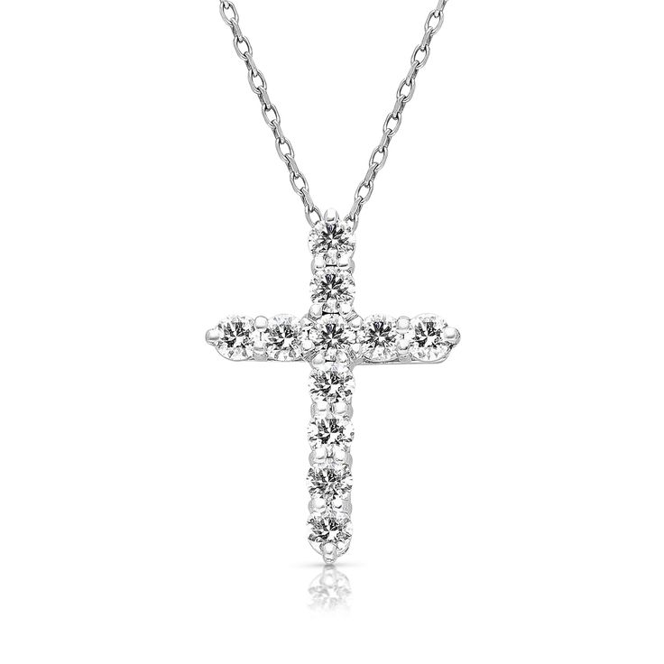 a diamond cross necklace on a white background