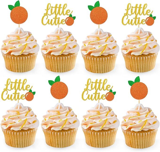 six cupcakes with white frosting and orange icing on them, each decorated with