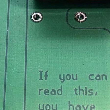 a close up of an electronic device with a message on the front and back side