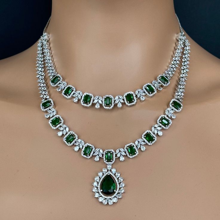 Green CZ diamond Layered bridal necklace, American Diamond wedding necklace, Cz jewelry, Indian, Pakistani, Punjabi wedding jewelry Cubic Zirconia 2 Line Necklace With Rhodium Plating Regular Size And Adjustable with rhodium finish Ships from California, USA Delivery in 2-5 business days in the USA. Other colors can be found here https://www.etsy.com/listing/1423097794/sapphire-cz-diamond-bridal-necklace?ref=listings_manager_grid https://www.etsy.com/listing/1423095388/emerald-cz-diamond-bridal-necklace?ref=listings_manager_grid Color, shades, and texture displayed may slightly vary from the actual product due to digital image limitations. We request you consider these minor variations. Please expect the possibility of some slight imperfections when buying handmade jewelry. Please let me k Wedding Diamond Necklace With Jewels In Cubic Zirconia, Wedding Diamond Necklace With Cubic Zirconia, Wedding Cubic Zirconia Diamond Necklace, Diamond White Cubic Zirconia Bridal Necklace With Jewels, Diamond White Bridal Necklace With Cubic Zirconia, Fine Jewelry Bridal Necklace With Crystals And Jewels, Cubic Zirconia Emerald Necklace For Wedding, Wedding Emerald Necklace With Diamond Accents, Diamond White Jeweled Necklace For Wedding