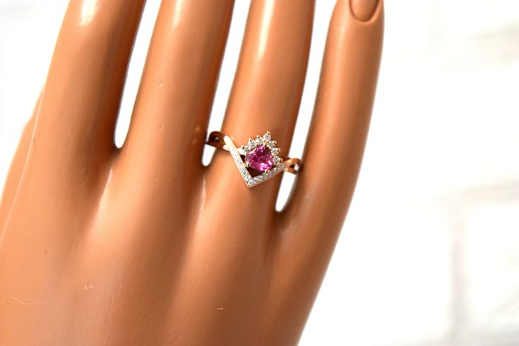 One of a kind engagement ring featuring one pink sapphire (pear shape) accompanied by natural diamonds in 14kt rose gold. The ring is so gentle and so girly! We loved creating it an hope you love it too Once the ring is purchased you will be sent different options for center stone (2-3 pink sapphires to choose from until you find the one you love) Ring production will take 1-2 weeks to make! Details of the ring: Metal: 14kt white/yellow or rose gold Gemstone weight: 1ct or bigger-you will be con Pink Diamond Ring With Diamond Accents For Promise, Pink Solitaire Diamond Ring For Anniversary, Pink Dainty Ruby Wedding Ring, Pink Diamond Ring With Accents For Promise, Pink Ruby Ring With Diamond For Anniversary, Pink Solitaire Diamond Promise Ring, Pink Promise Diamond Ring With Accents, Pink Sapphire Ring With Diamond Accents For Anniversary, Pink Ruby Ring With Cubic Zirconia For Formal Occasions