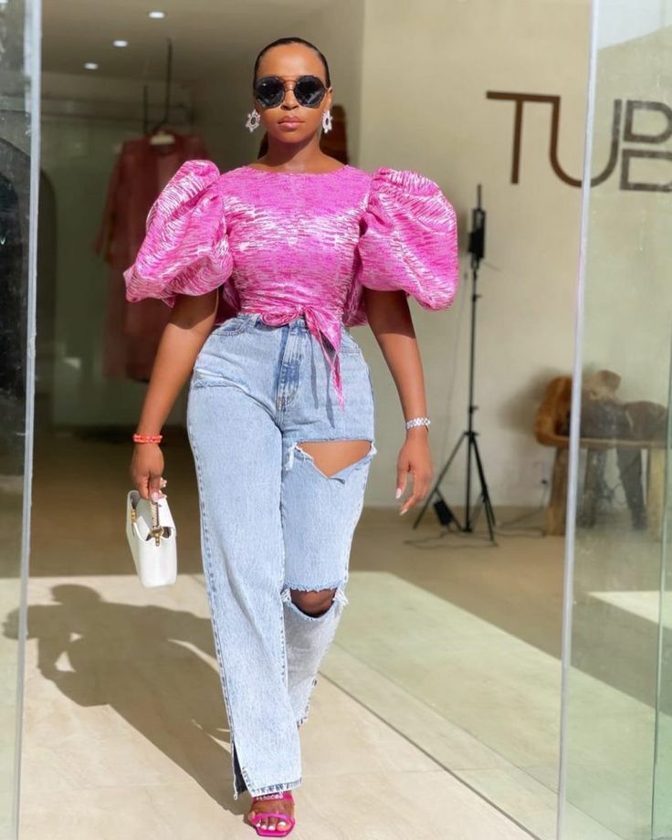 Mom Jeans Inspo: How To Slay The Trend Effortlessly | GlamCityz Material Top Styles For Ladies, Top Styles For Ladies, Horseshoe Jeans, Chic Dress Classy, 2piece Outfits, Exaggerated Sleeves, Classy Dress Outfits, African Fashion Women, African Print Fashion Dresses