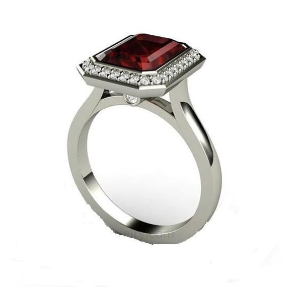 "Product description: Product Type - Ring Metal Type - 925 Solid Sterling Silver (High Quality Polishing & Finishing) Gemstone - Natural Rhodolite Garnet Gemstone Size - 7X9 MM Gemstones Shape - Octagon Accent Stone - CZ Gemstone color - As Picture Gemstone Purity - 100% Natural (Guaranteed) Standard Shipping - 3 to 7 Days ($25 Extra) Economy Shipping - 10 to 20 Days (Free Worldwide) Please Note - Color in the picture may be slightly different from the actual product. Due to photographic lig 14k White Gold Ruby Ring With Halo Setting, Formal Lab-created Ruby Ring With Halo Setting, Formal Ruby Birthstone Ring With Accent Stones, Formal Sterling Silver Birthstone Ring, Luxury Sterling Silver Emerald Ring With Halo Setting, Formal Rings With Halo Design And Lab-created Ruby, Formal Ruby Halo Ring With Prong Setting, Elegant Garnet Ring With Bezel Setting, Formal Ruby Birthstone Ring With Halo Setting