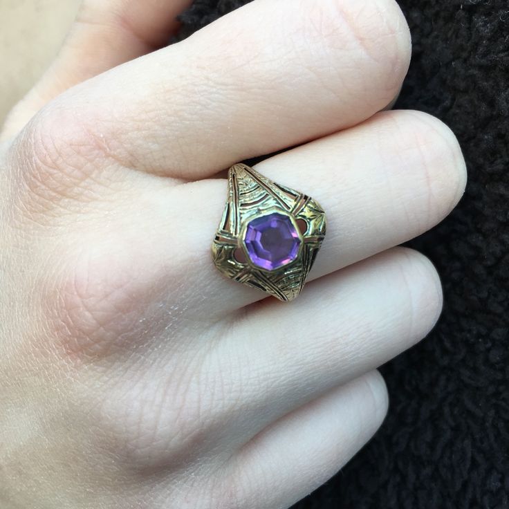 Details: Victorian 14K gold Art Deco amethyst ring circa 1930's. Beautiful deco design, with leaf inspired pattern. The lovely amethyst measures 6.7mm x 6.7mm, and sits about 5.5mm from the finger. The setting measures 15.4mm from top to bottom. The ring is in excellent condition. Please ask all necessary questions prior to placing an order. Measurements: The size is 7 US and can be sized for a fee. Condition: The overall all condition of this ring is excellent condition and the stone is securel Antique 14k Gold Amethyst Ring, Purple Amethyst Hallmarked Signet Ring, Art Deco Oval Purple Amethyst Ring, Gold Oval Amethyst Ring In Art Deco Style, Art Deco Purple Amethyst Ring For Anniversary, Art Deco Purple Amethyst Ring For Formal Occasions, Purple Amethyst Art Deco Ring For Formal Occasions, Purple Amethyst Art Deco Ring For Anniversary, Formal Art Deco Purple Amethyst Ring