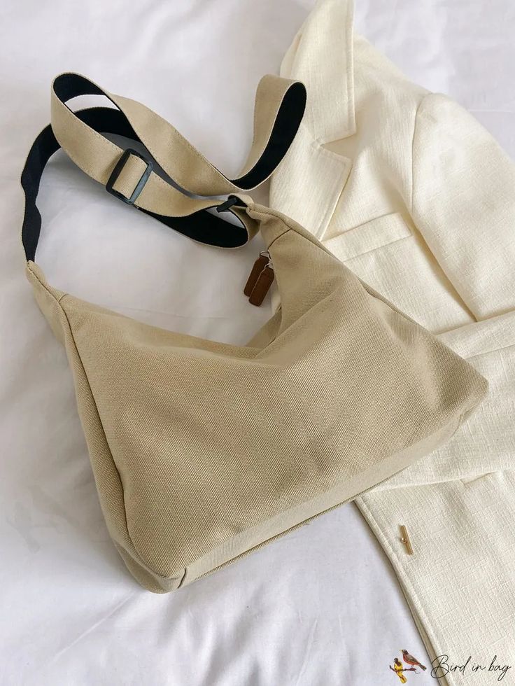 BirdinBag - Stylish Shoulder Bag with Ample Space and Decorative Pendant Versatile Canvas Crossbody Hobo Bag, Large Capacity Beige Shoulder Bag For School, Beige Large Capacity Shoulder Bag For School, Versatile Softback Shoulder Bag With Detachable Strap, Canvas Crossbody Hobo Bag, Everyday Canvas Crossbody Bag With Single Shoulder Strap, Beige Canvas Shoulder Bag For School, Everyday Tote Baguette Bag With Adjustable Handle, Beige Hobo Tote Bag For School